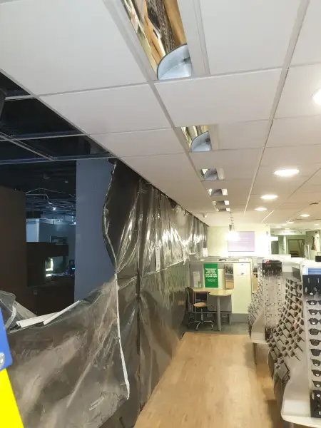 Expansion knock through to the new unit at Birkenhead Specsavers: Swipe To View More Images