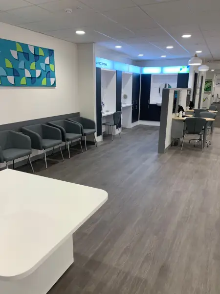 Completed waiting area and dispense desks at Birkenhead Specsavers: Swipe To View More Images
